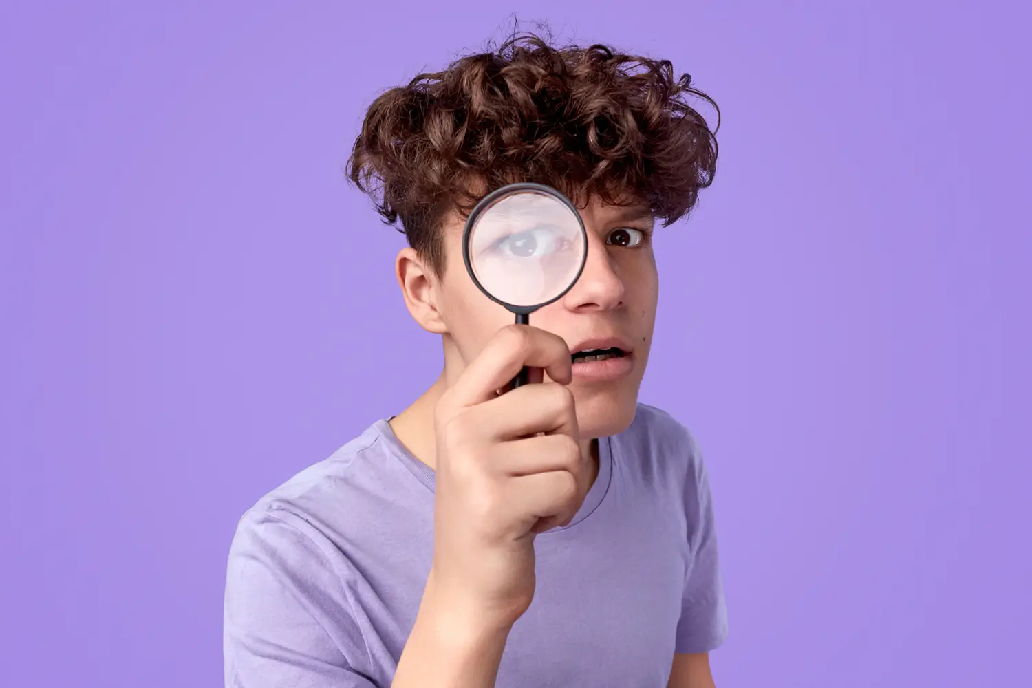 Person using a magnifying glass