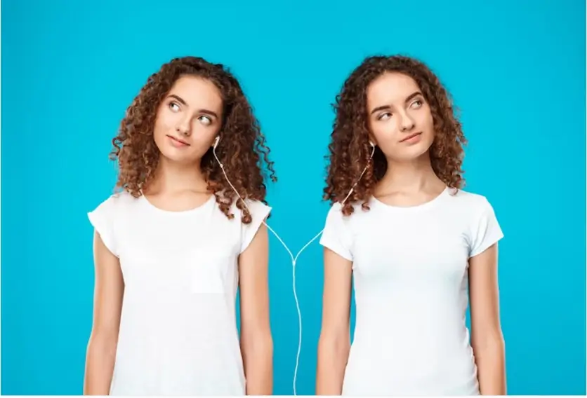 Twins listening to an ipod